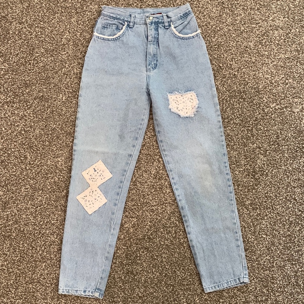 Light wash jeans, with eyelet lace detailing, from 1993, tapered leg